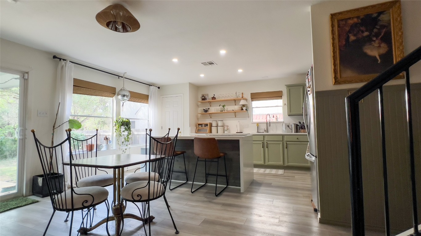 8908 West Hove Loop Austin, TX 78749 - Photo 5 of 20 a view of a dining room with furniture window and wooden floor