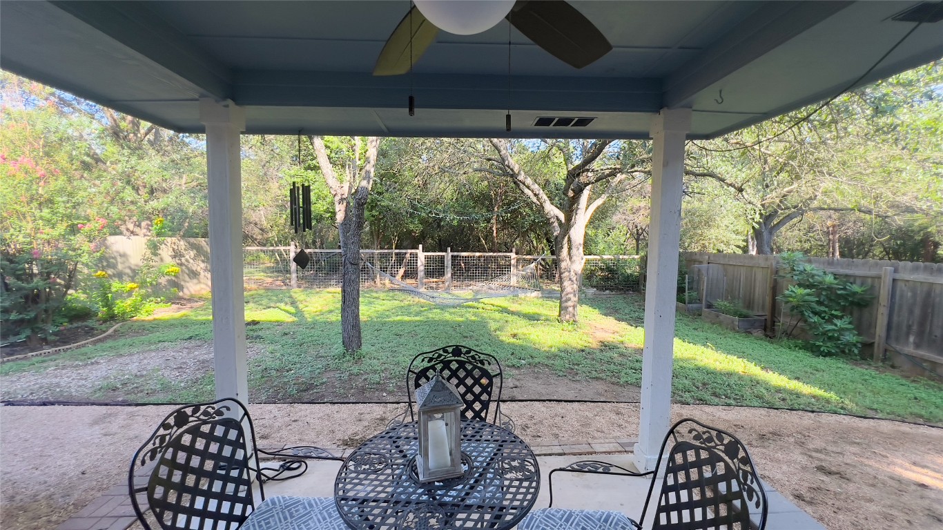 8908 West Hove Loop Austin, TX 78749 - Photo 6 of 20 a view of a porch with chairs and backyard