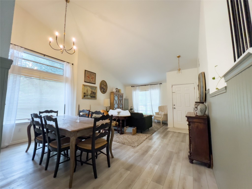 8908 West Hove Loop Austin, TX 78749 - Photo 10 of 20 a view of a dining room with furniture and wooden floor
