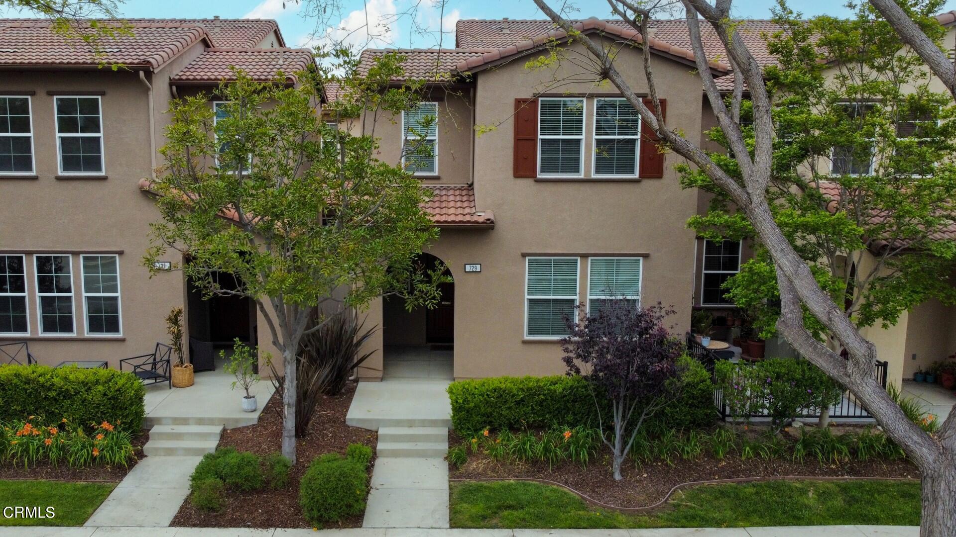 729 Forest Park Boulevard Oxnard, CA 93036 - Photo 27 of 27 a front view of a house with a yard and potted plants