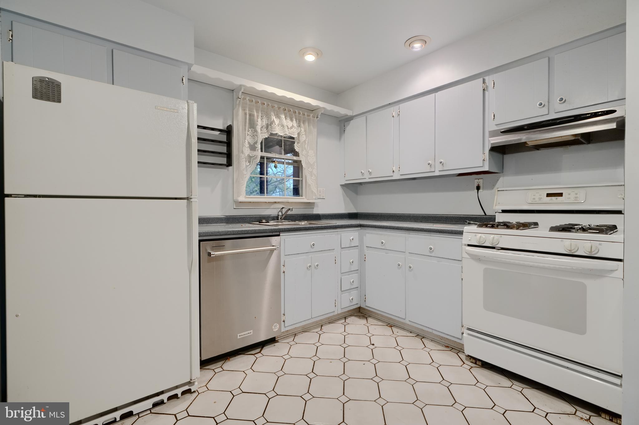 113 Doncaster Road Joppa, MD 21085 - Photo 15 of 43 a kitchen with appliances cabinets and a sink