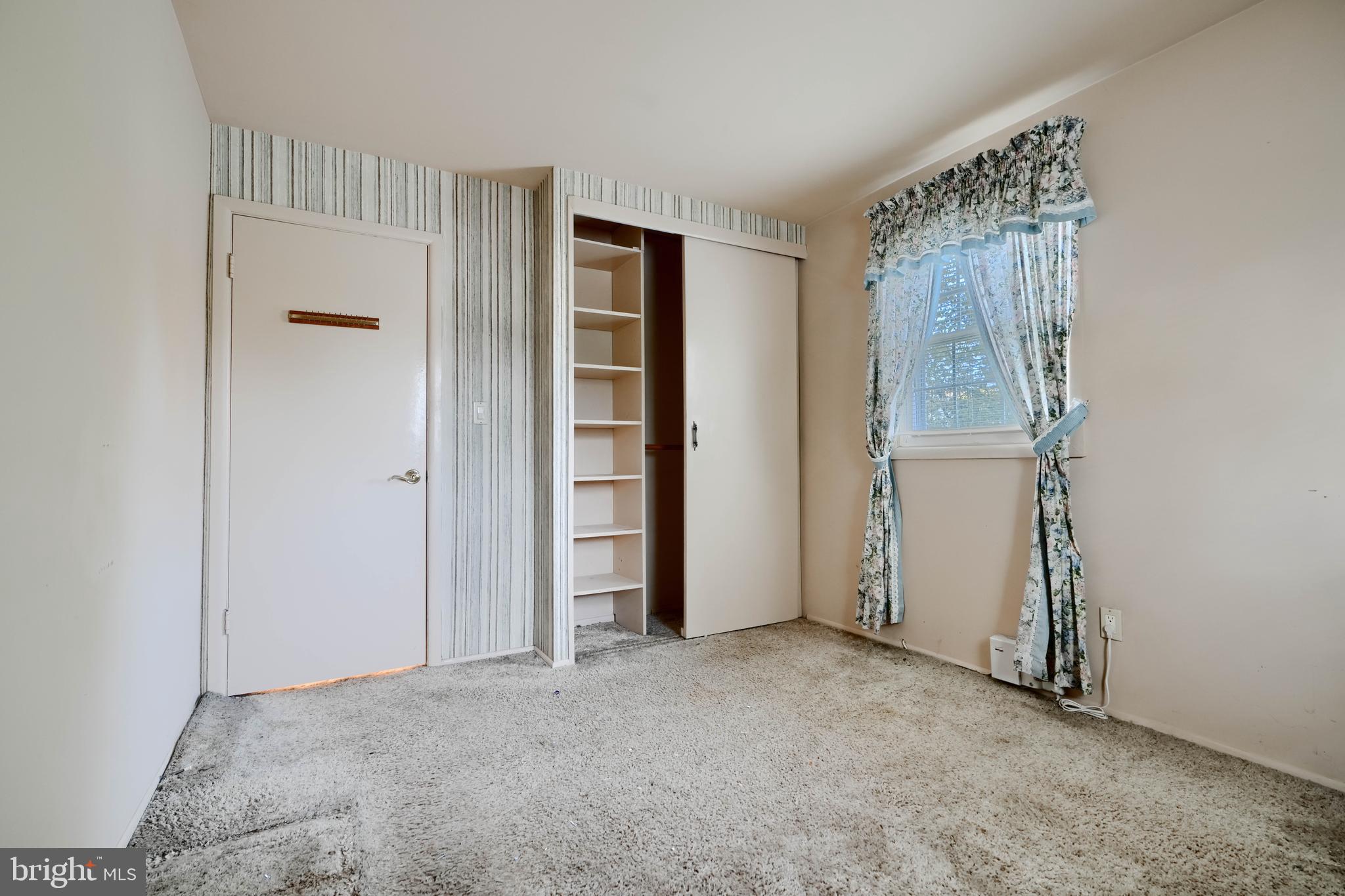 113 Doncaster Road Joppa, MD 21085 - Photo 21 of 43 an empty room with windows and closet