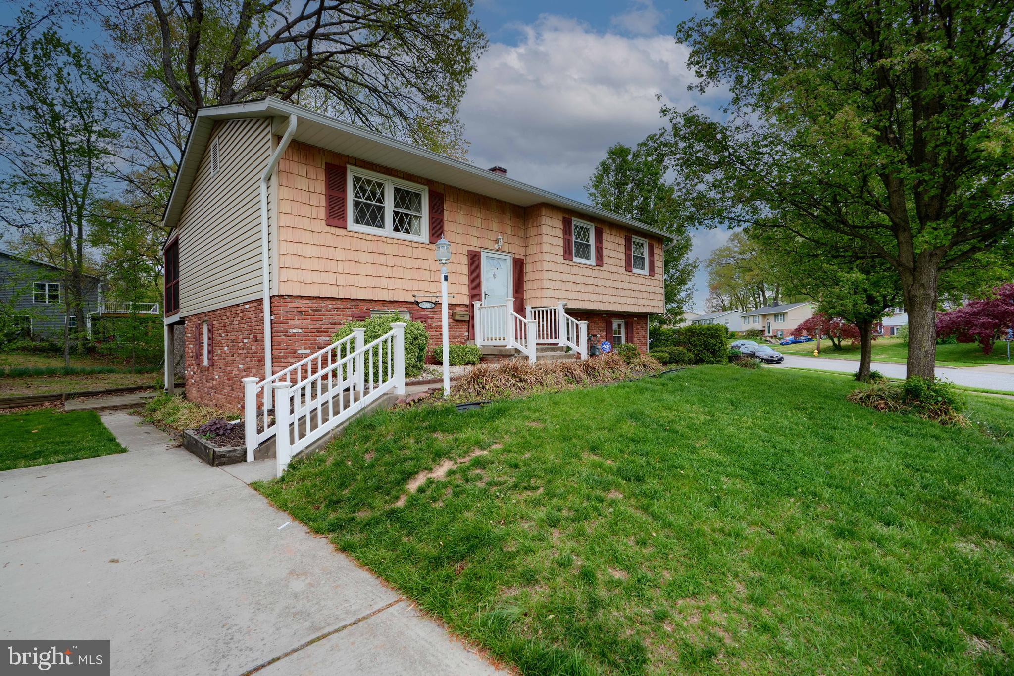 113 Doncaster Road Joppa, MD 21085 - Photo 3 of 43 a front view of a house with yard and tree s