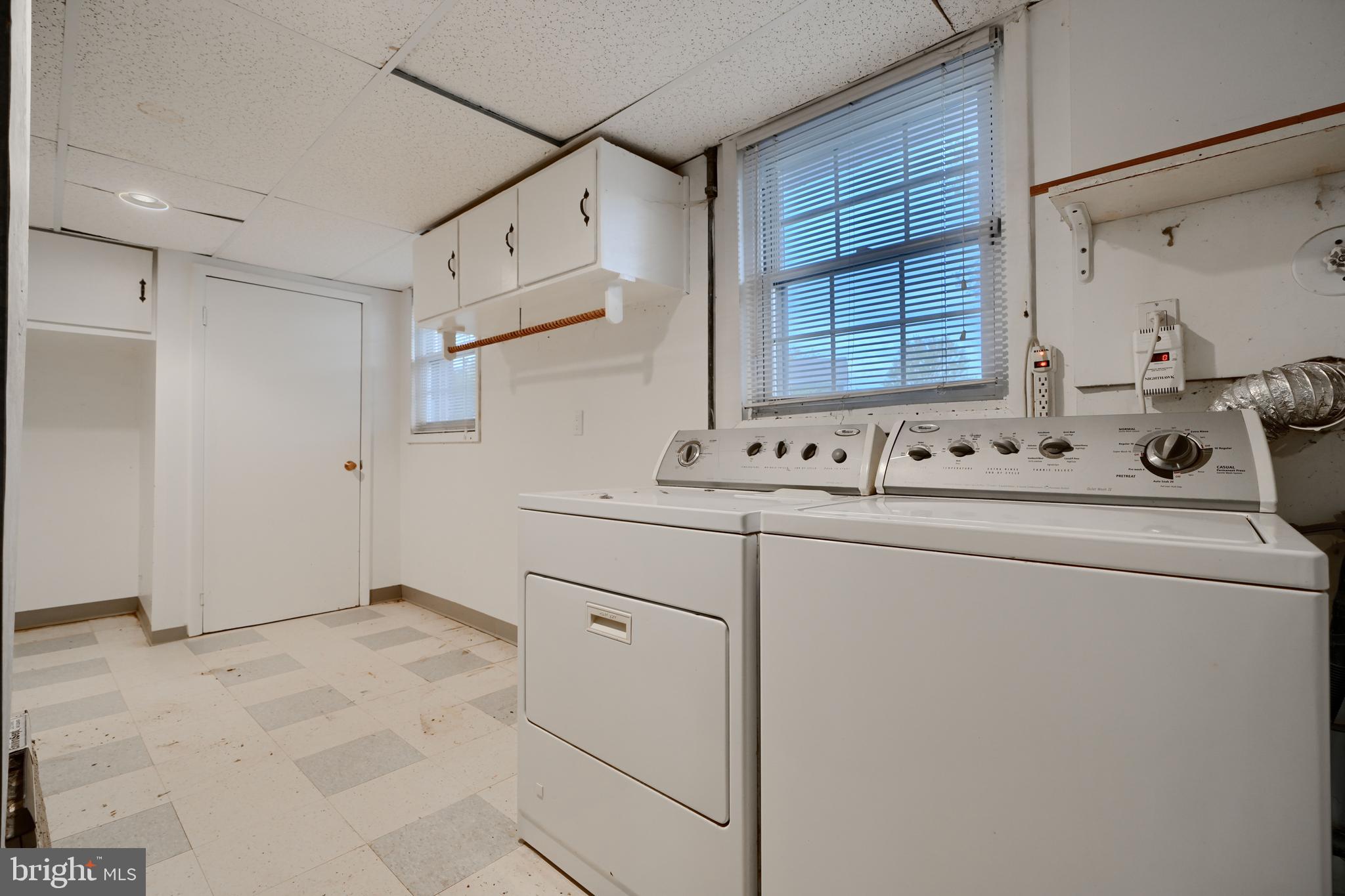 113 Doncaster Road Joppa, MD 21085 - Photo 33 of 43 a utility room with cabinets washer and dryer