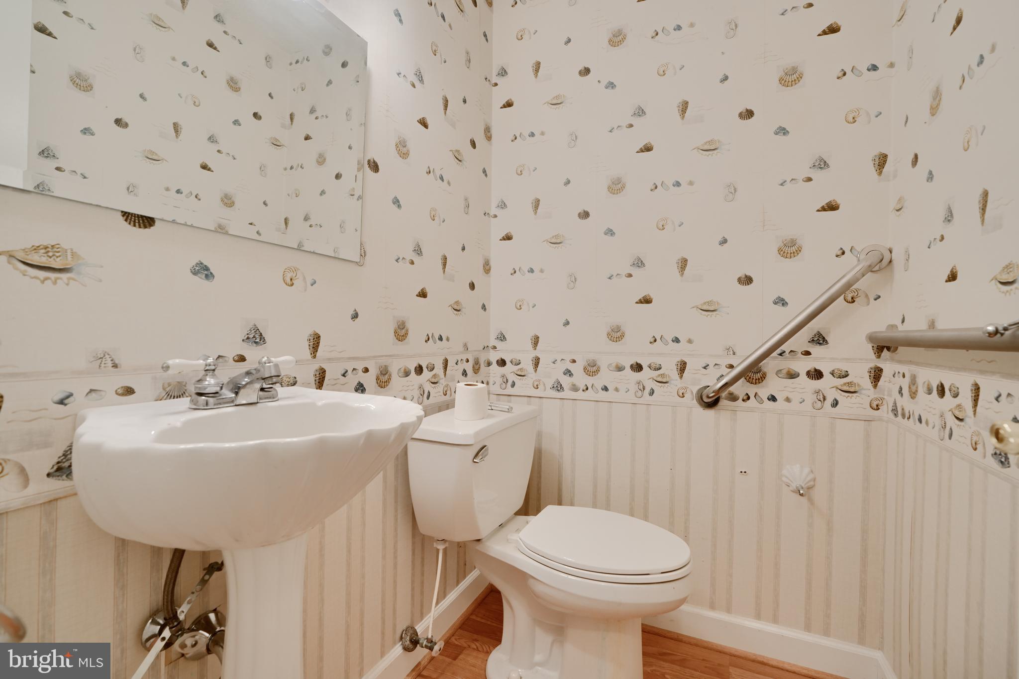 113 Doncaster Road Joppa, MD 21085 - Photo 37 of 43 a bathroom with a sink mirror and toilet