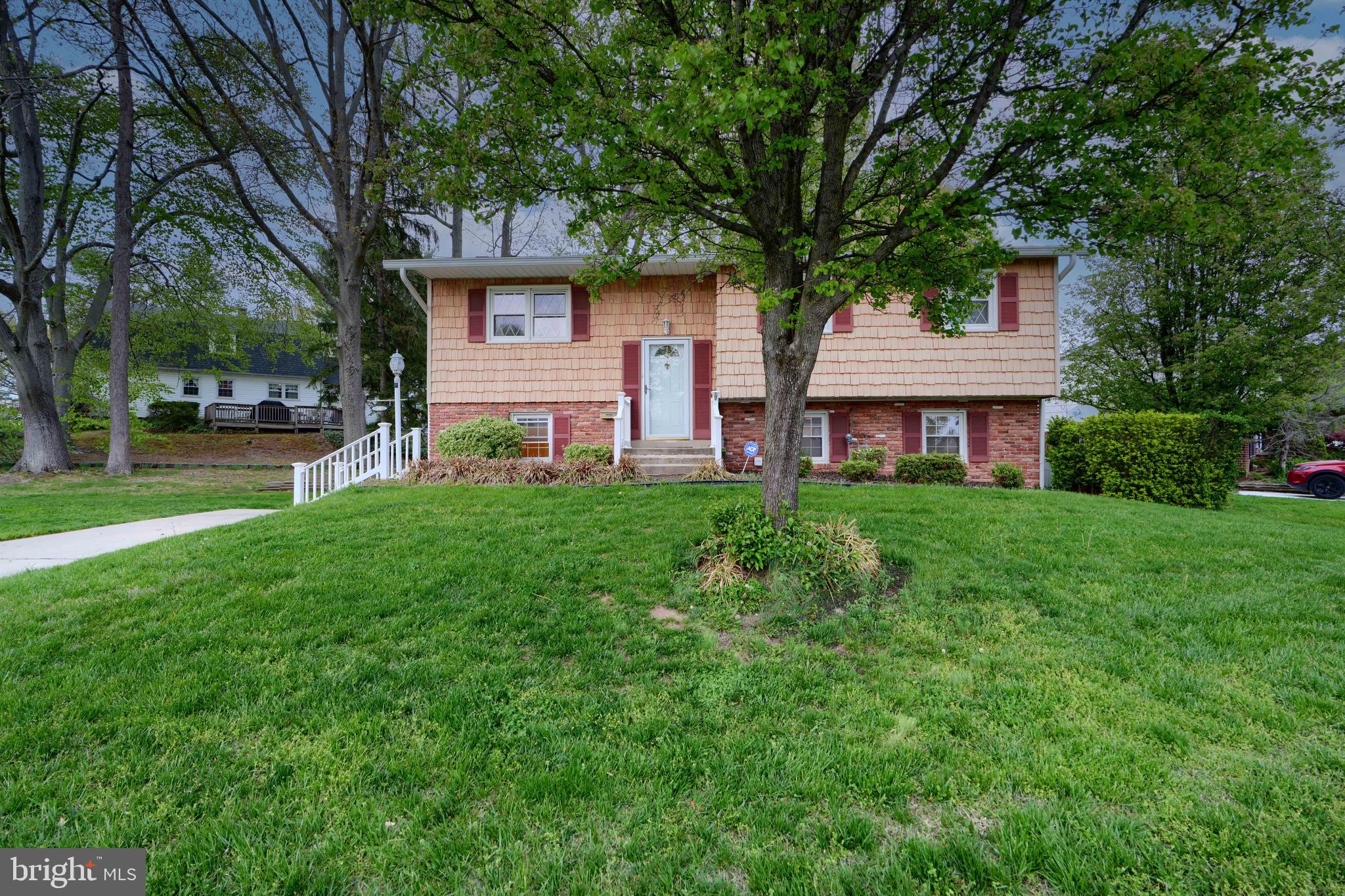113 Doncaster Road Joppa, MD 21085 - Photo 43 of 43 a front view of a house with a yard and trees
