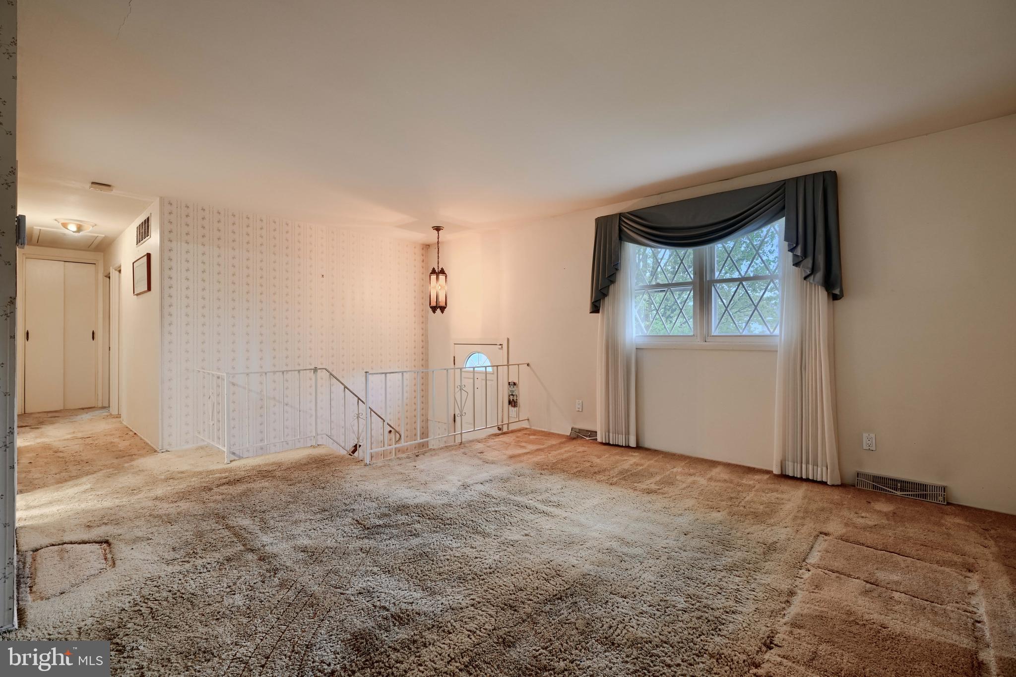 113 Doncaster Road Joppa, MD 21085 - Photo 9 of 43 an empty room with a empty space and windows