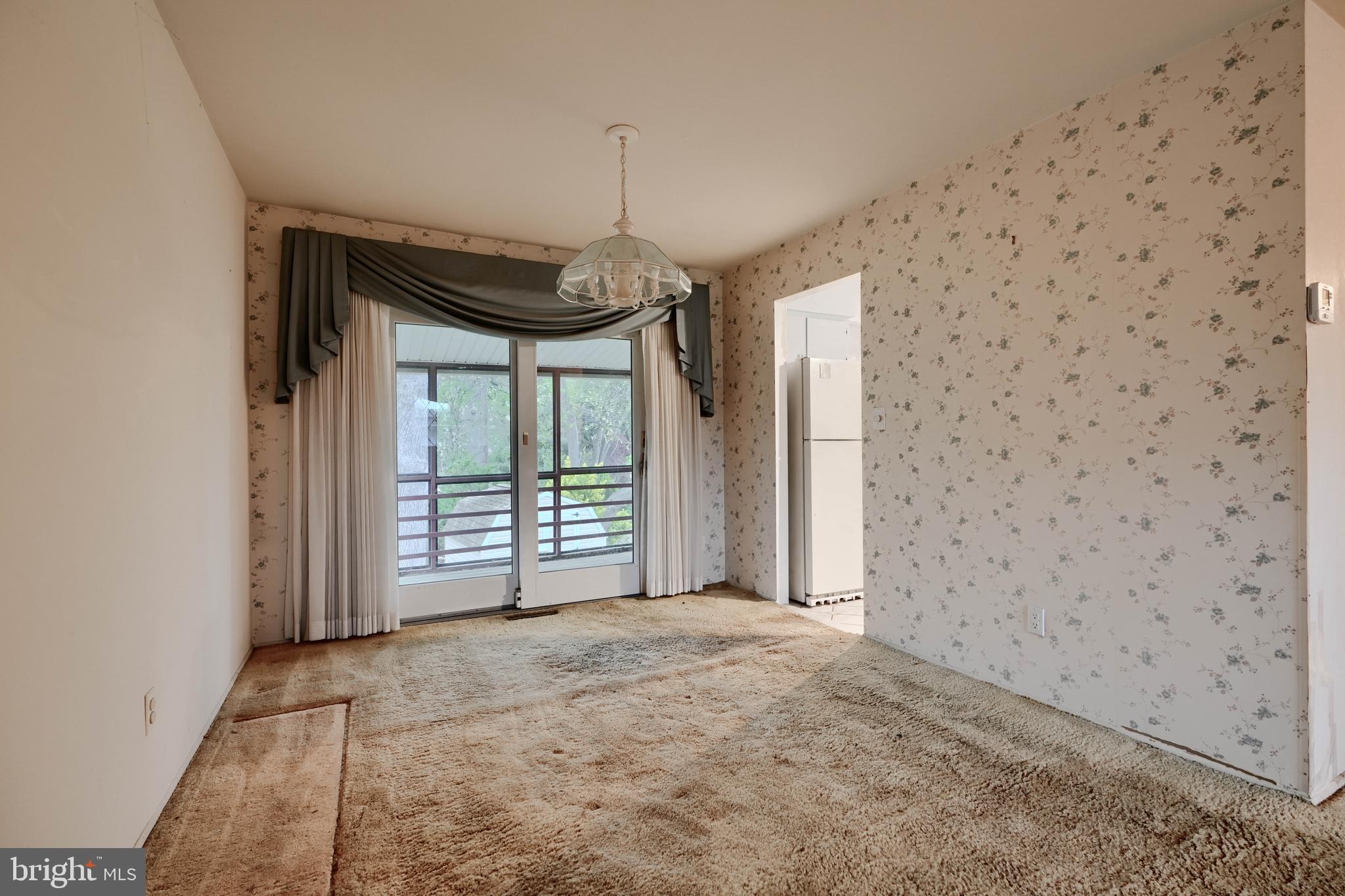 113 Doncaster Road Joppa, MD 21085 - Photo 10 of 43 a view of a livingroom with a staircase and a ceiling fan
