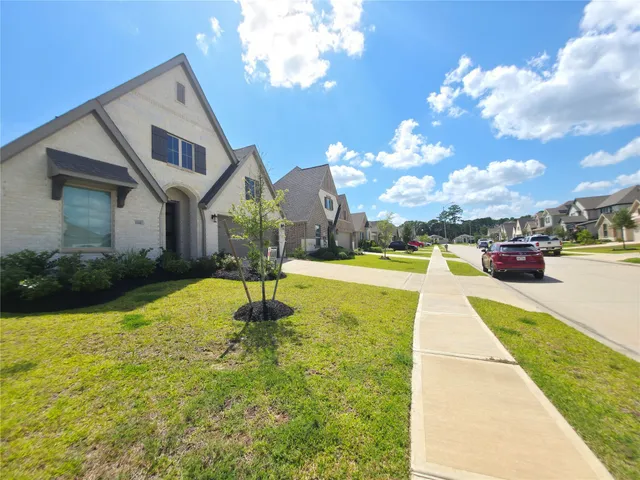 a house view with swimming pool and sitting space