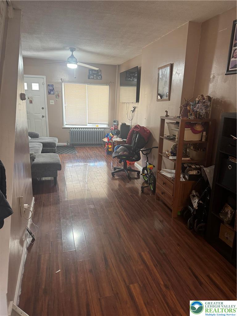 911 Marion Street Reading, PA 19604 - Photo 15 of 16 a living room with furniture and a wooden floor