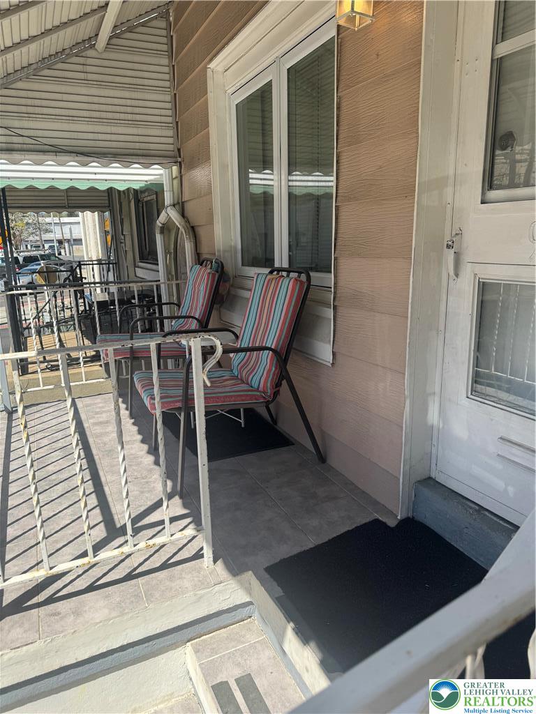 911 Marion Street Reading, PA 19604 - Photo 2 of 16 a view of a balcony with chairs and table