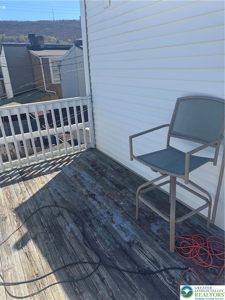 911 Marion Street Reading, PA 19604 - Photo 10 of 16 a balcony with wooden floor