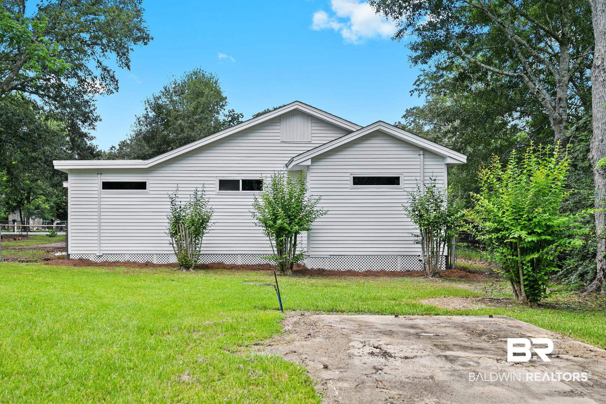 507 Byrne Street Bay Minette, AL 36507 - Photo 36 of 40 View of side of home featuring a yard
