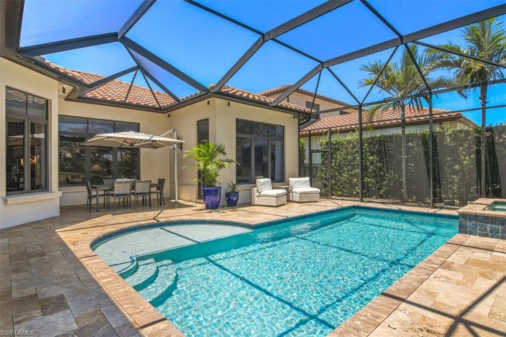 2220 Residence Circle Naples, FL 34105 - Photo 31 of 50 a view of a house with swimming pool and porch