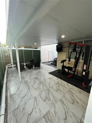 a view of a room with gym equipment