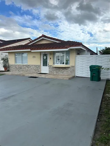 a view of a house with a street