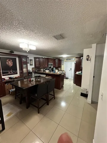 a room with lots of furniture and clutter