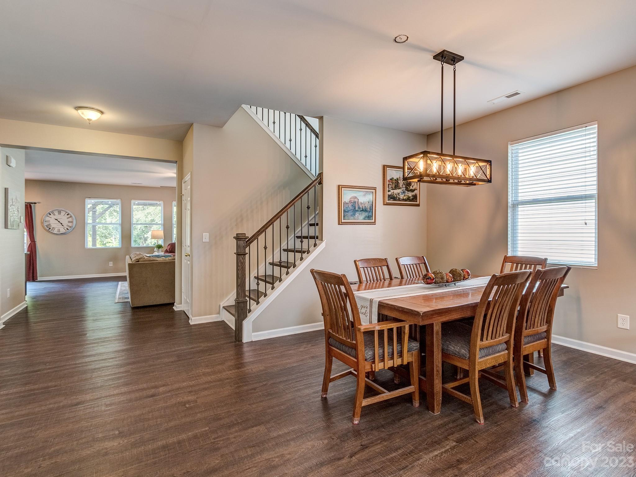 1119 Spicewood Pines Road Fort Mill, SC 29708 - Photo 7 of 38 a view of a dining room with furniture wooden floor and chandelier