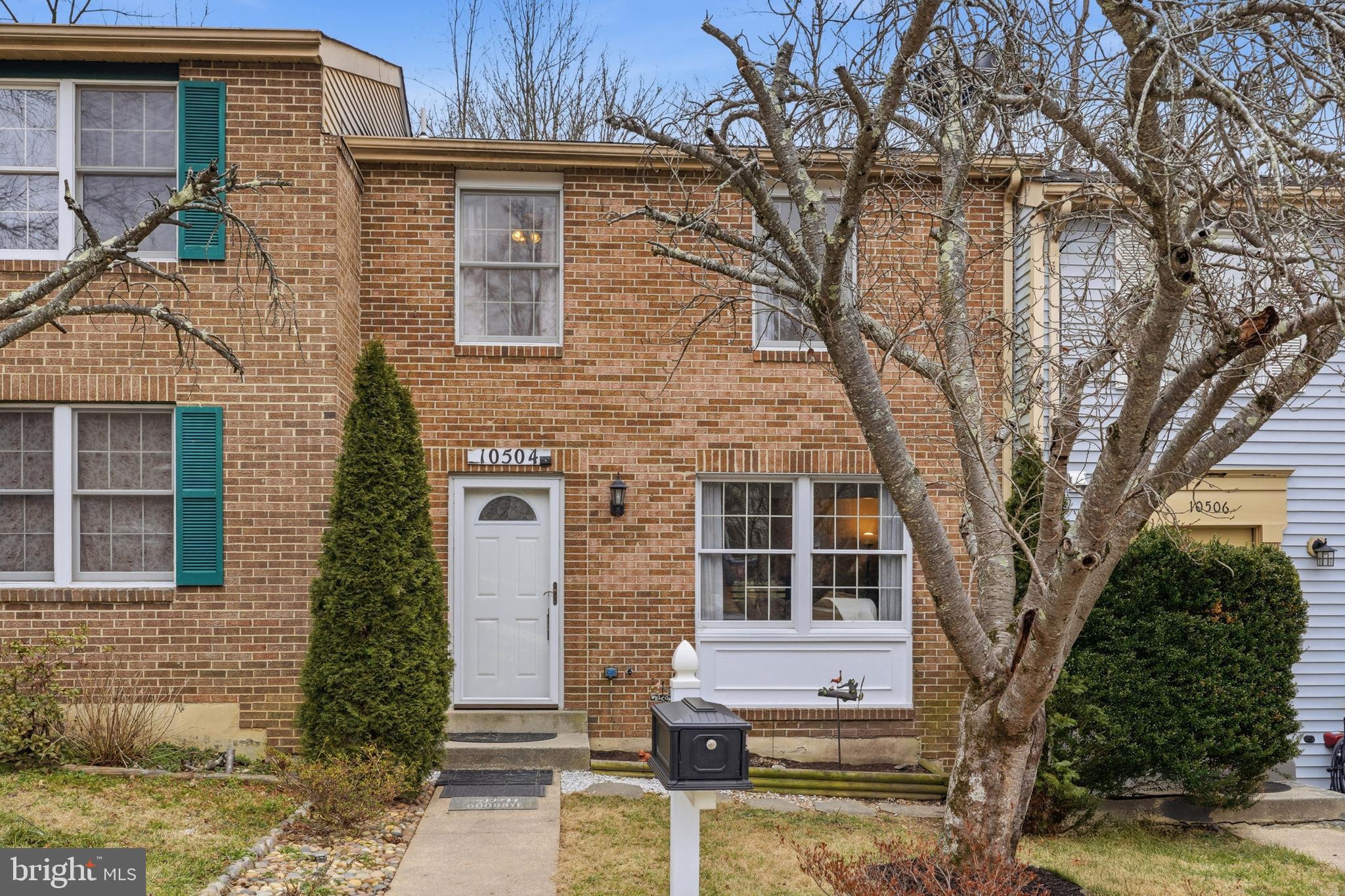 10504 Apple Ridge Road Gaithersburg, MD 20886 - Photo 1 of 33 a front view of a house with a tree