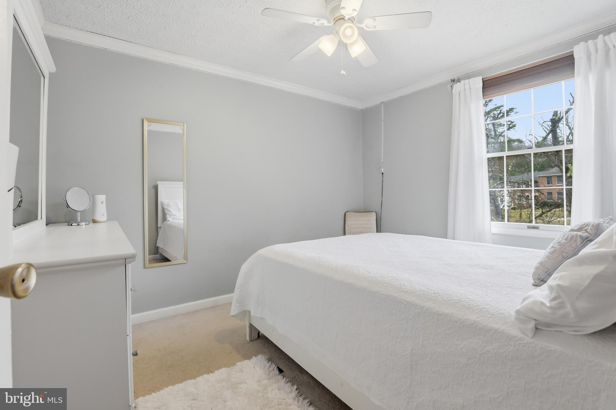 10504 Apple Ridge Road Gaithersburg, MD 20886 - Photo 16 of 33 a bedroom with a bed and a chandelier