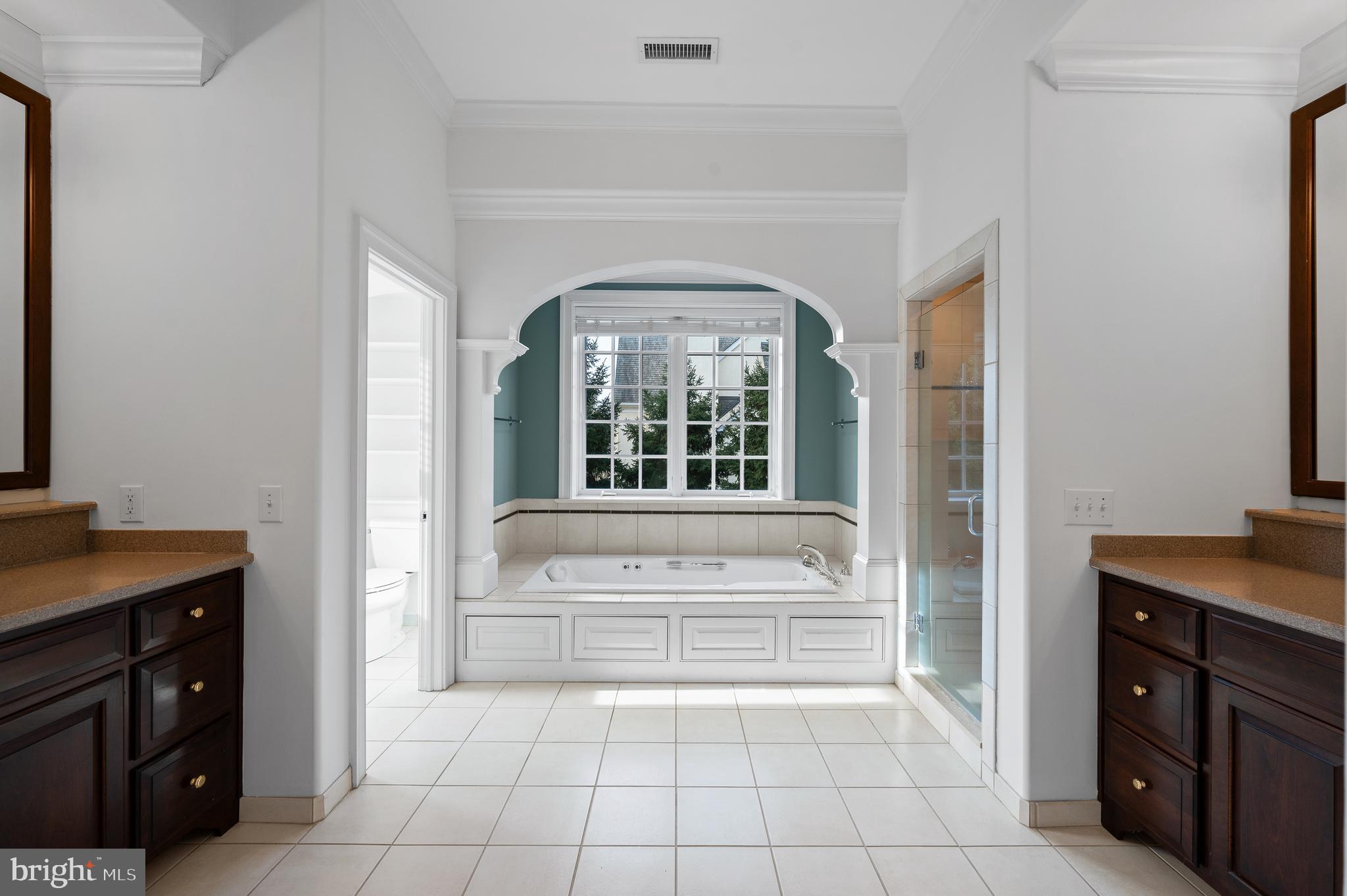 1659 Boot Road West Chester, PA 19380 - Photo 34 of 65 a spacious bathroom with a tub sink and mirror