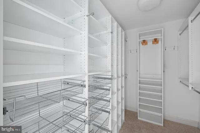 a room with pool table and window