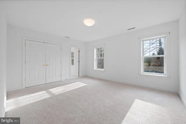 a kitchen with a stove and chairs