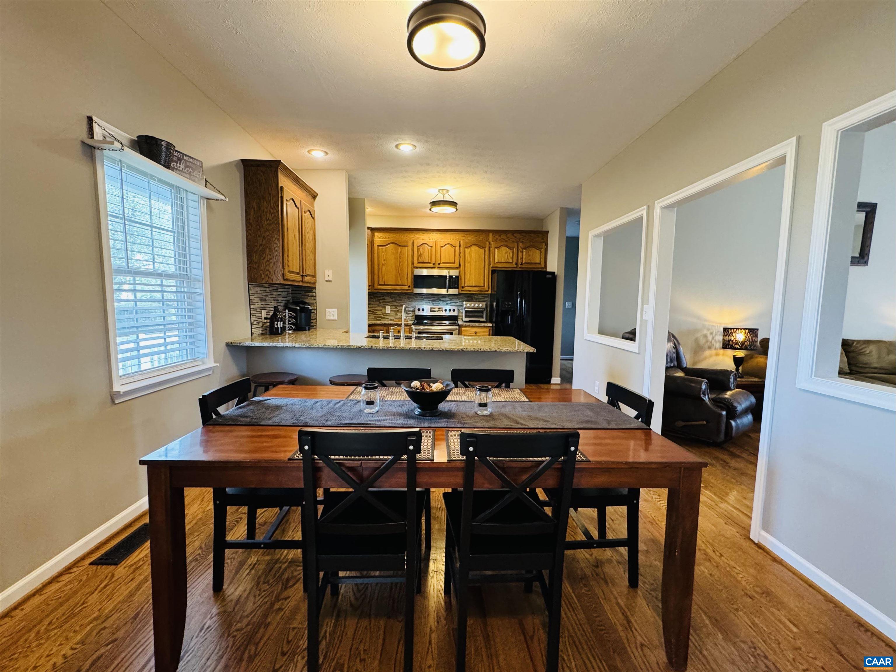 18 Forest View Lane Fishersville, VA 22939 - Photo 10 of 66 a view of a dining room with furniture and wooden floor