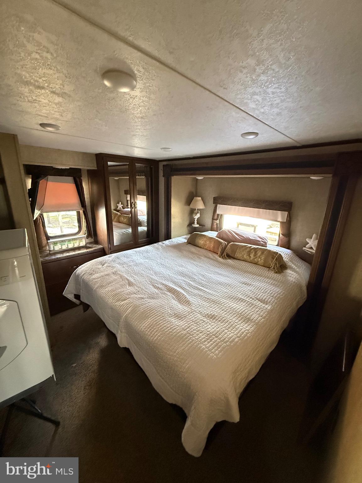 515 Corsons Tavern Road, Unit E26 Ocean View, NJ 08230 - Photo 7 of 8 main room with washer and dryer