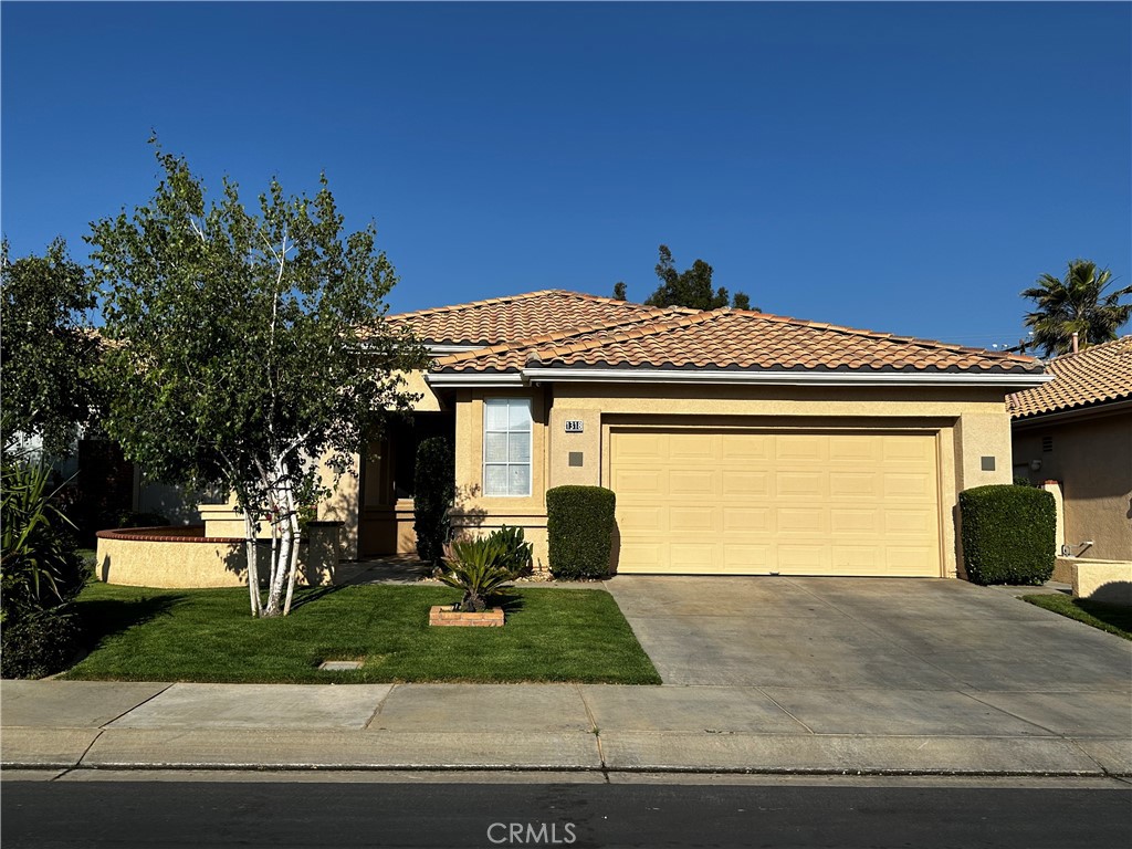 1318 South Bay Hill Road Banning, CA 92220 - Photo 1 of 1 a front view of a house with a garden
