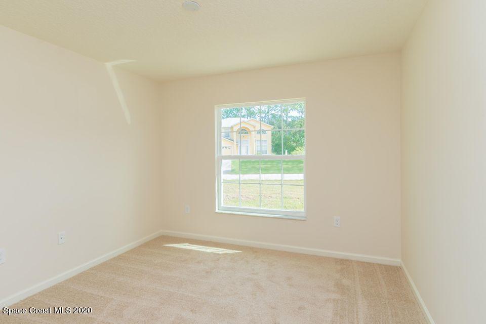 6150 Adina Road Cocoa, FL 32927 - Photo 11 of 13 an empty room with a window