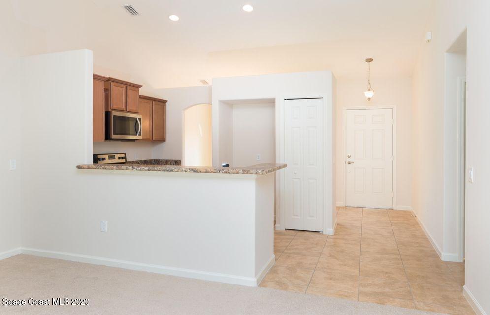 6150 Adina Road Cocoa, FL 32927 - Photo 4 of 13 a bathroom with a sink and a mirror
