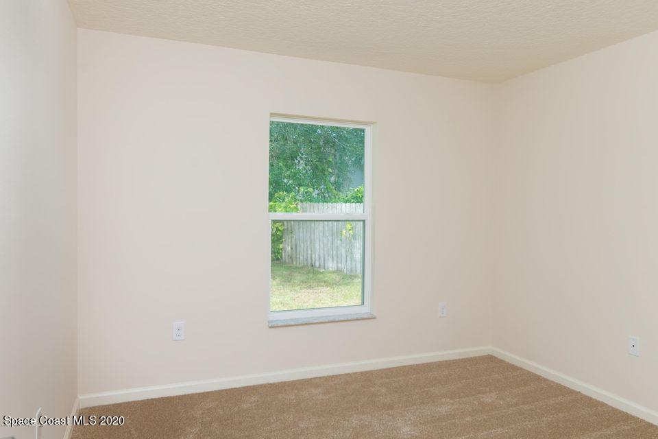 6150 Adina Road Cocoa, FL 32927 - Photo 10 of 13 an empty room with a window
