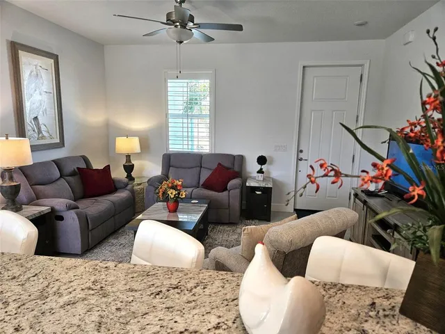 a living room with furniture and a window