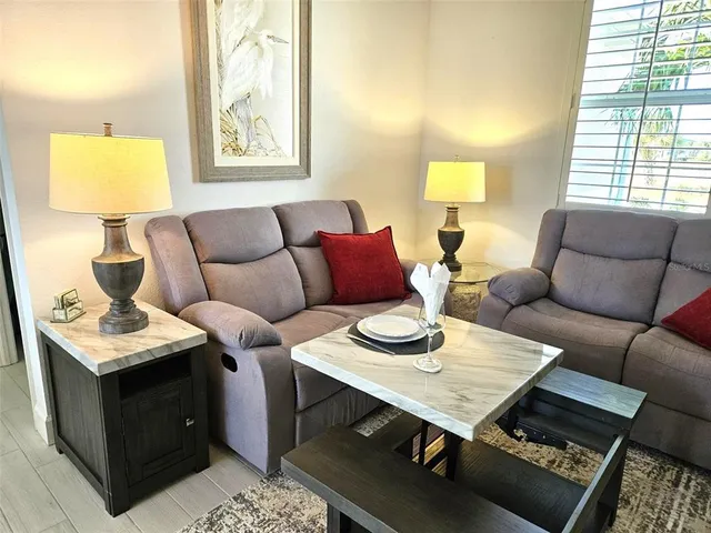 a living room with furniture and a window