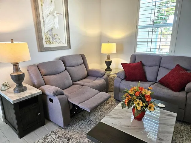 a living room with furniture and window