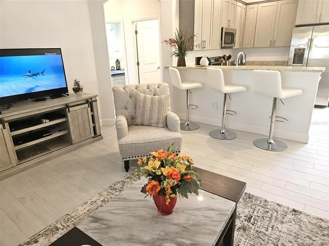 a kitchen with a table chairs and a stove
