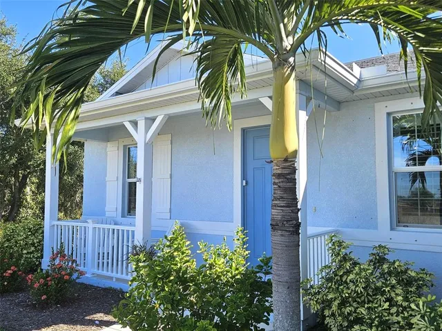a view of a house with a small garden