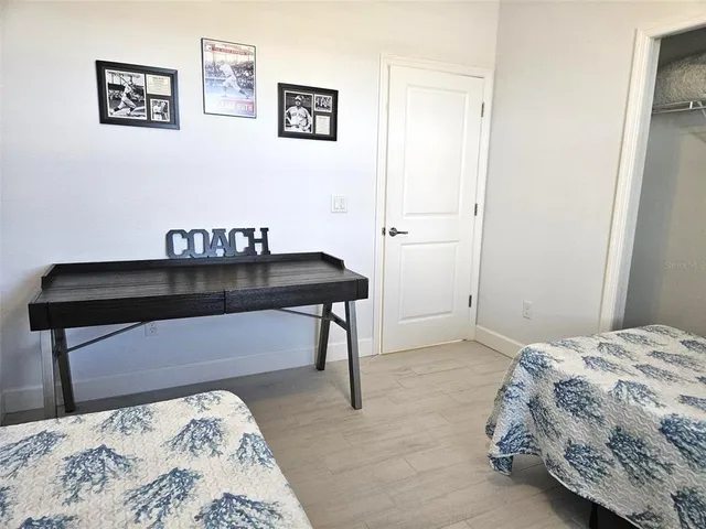 a bedroom with a bed and a table in it