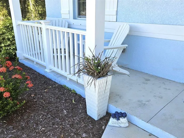a vase of flowers sitting on a floor