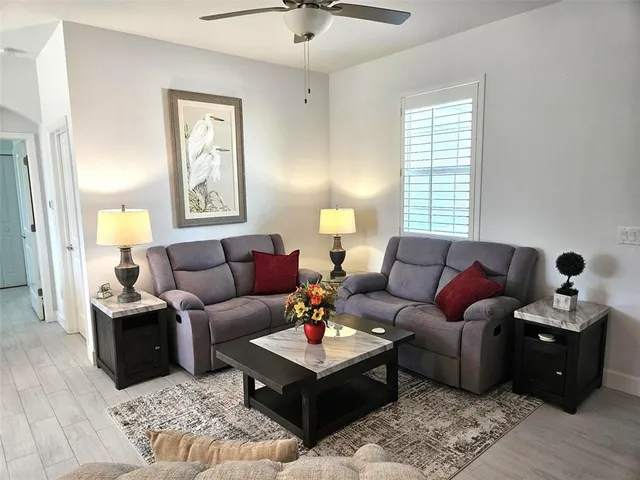 a living room with furniture and a window