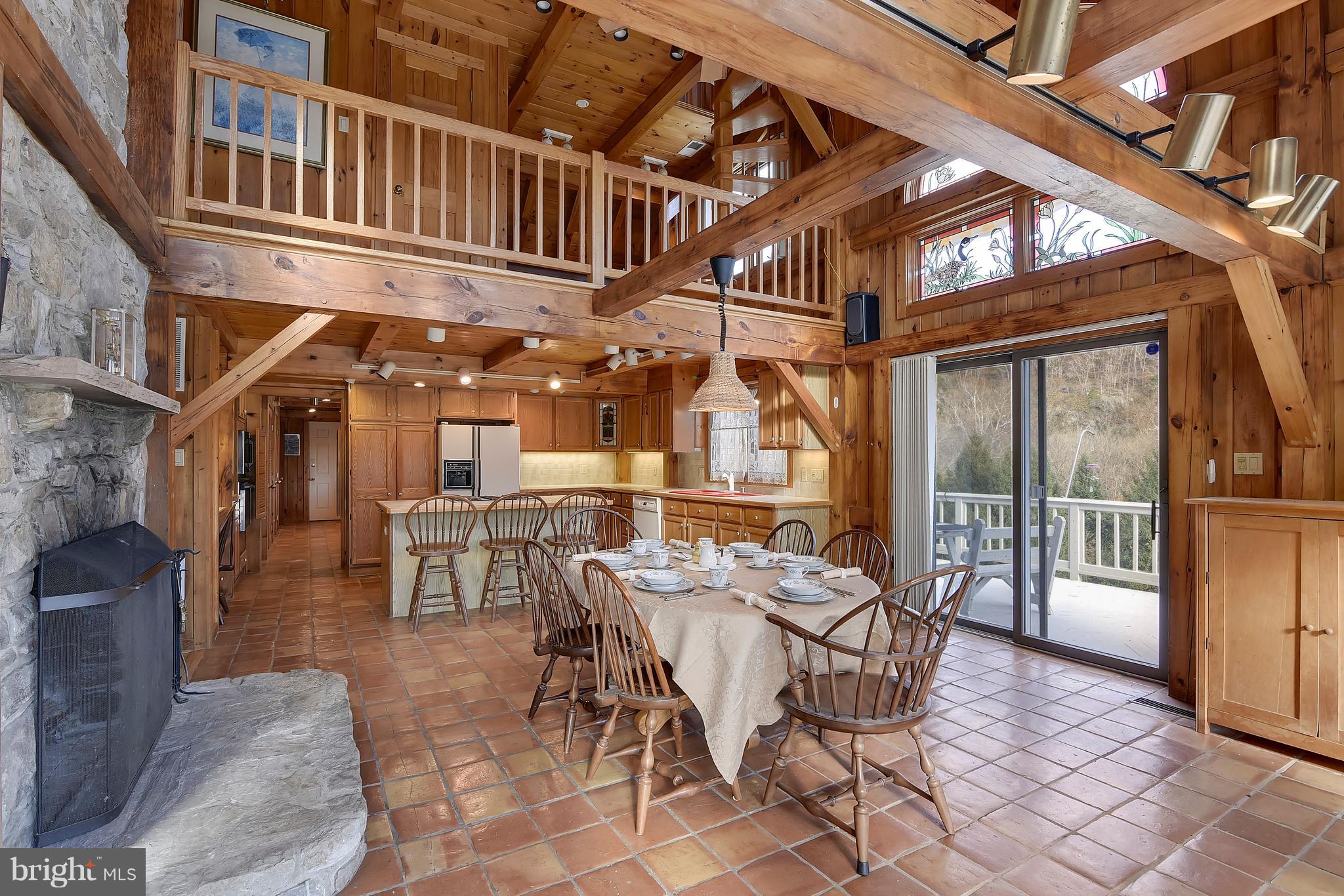 38243 Lime Kiln Road Middleburg, VA 20117 - Photo 20 of 94 Kitchen with Stone Fireplace and vaulted ceiling