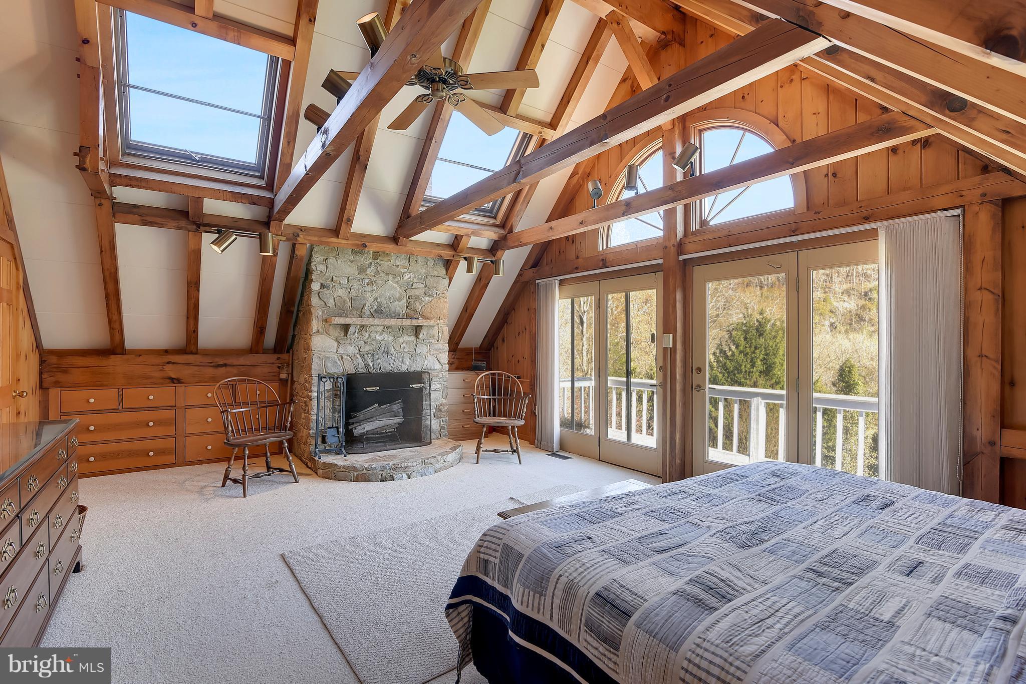 38243 Lime Kiln Road Middleburg, VA 20117 - Photo 40 of 94 Master Bedroom with stone fireplace & deck