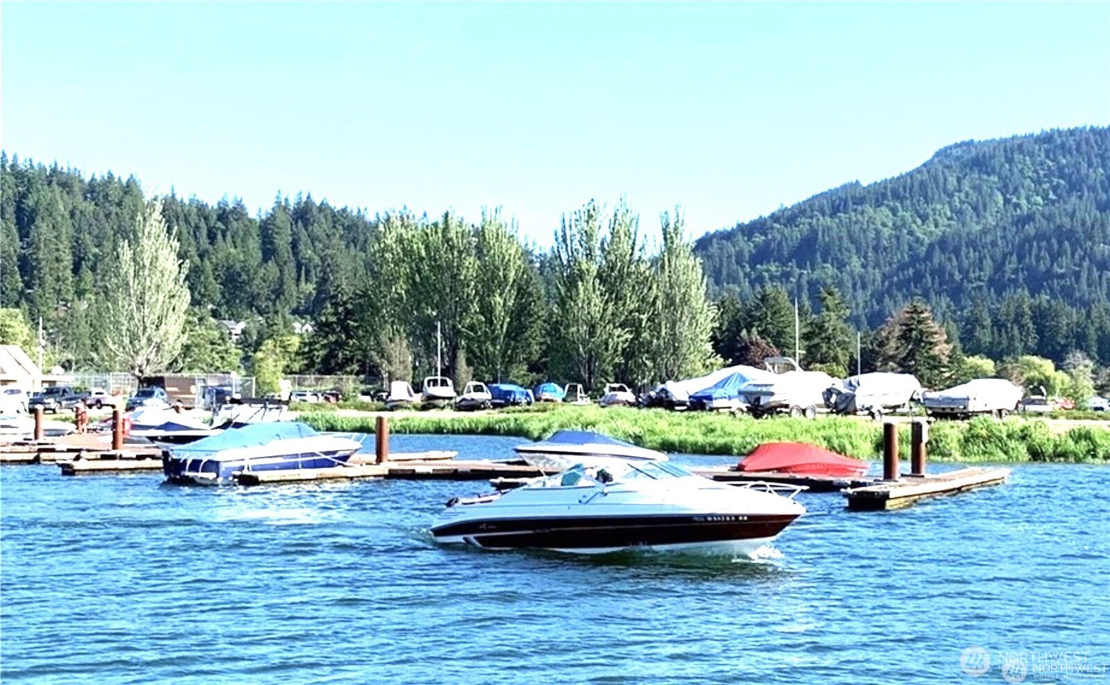 a view of swimming pool with lawn chairs and couches