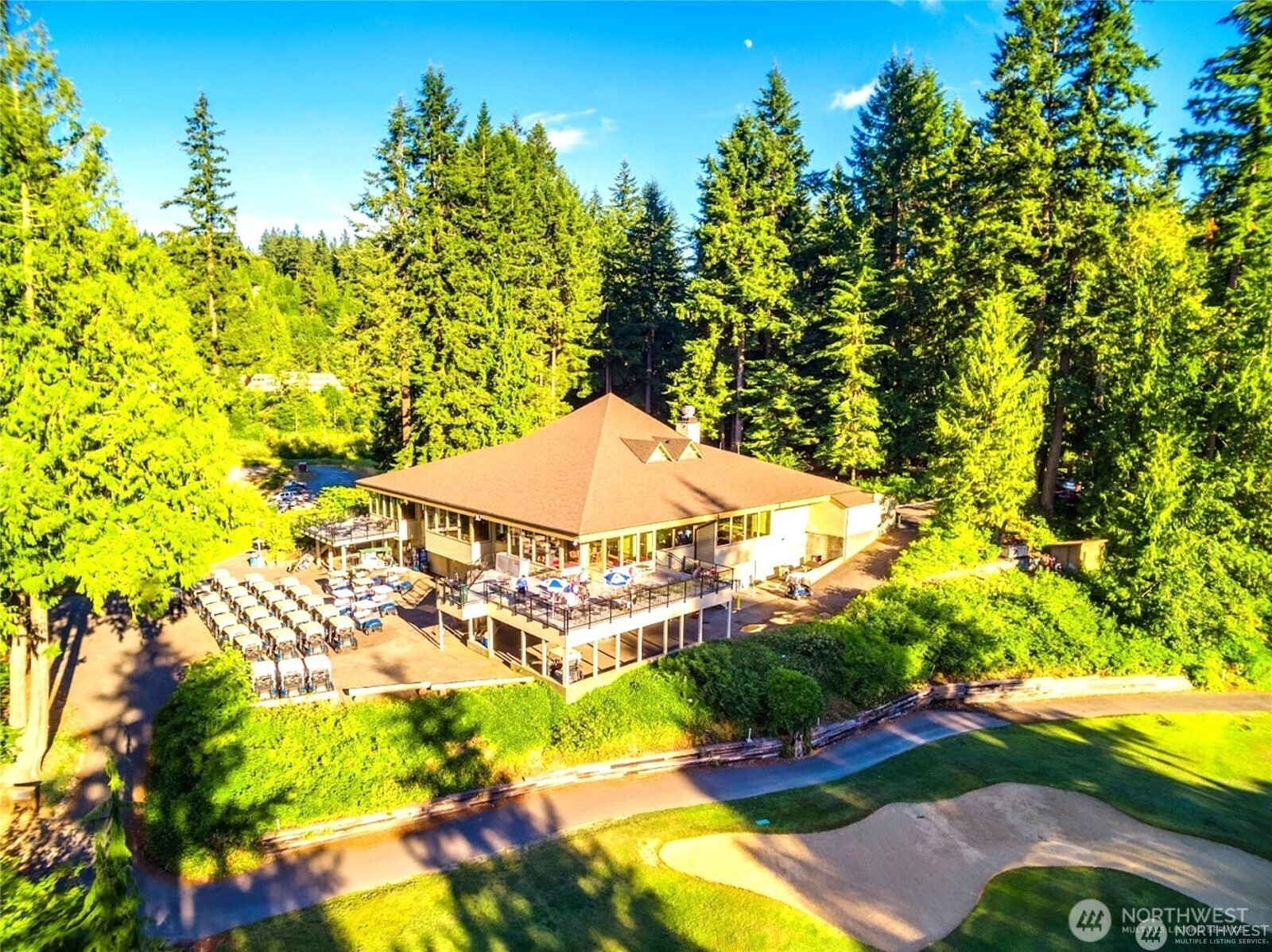 11 Granite Circle Bellingham, WA 98229 - Photo 5 of 8 a blue swimming pool is in front of a tree