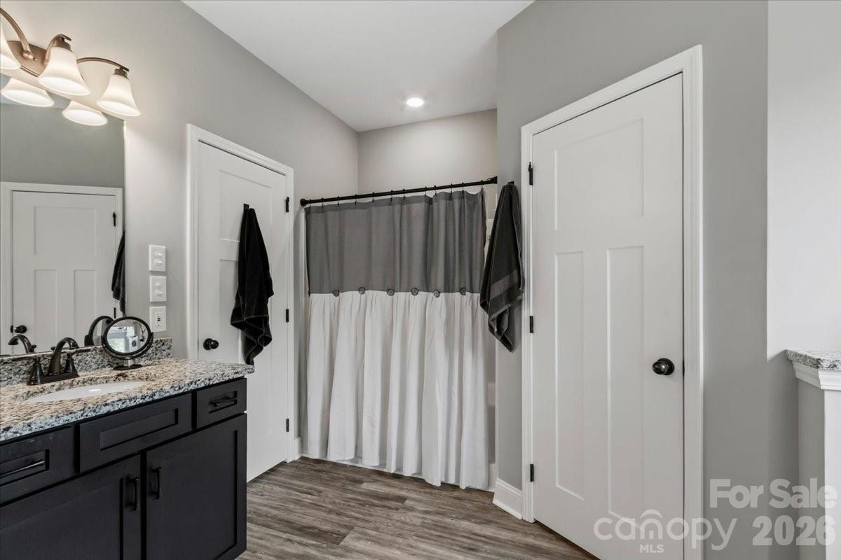 36 Cherry Ridge Lane Weaverville, NC 28787 - Photo 23 of 37 a bathroom with a double vanity sink and a mirror
