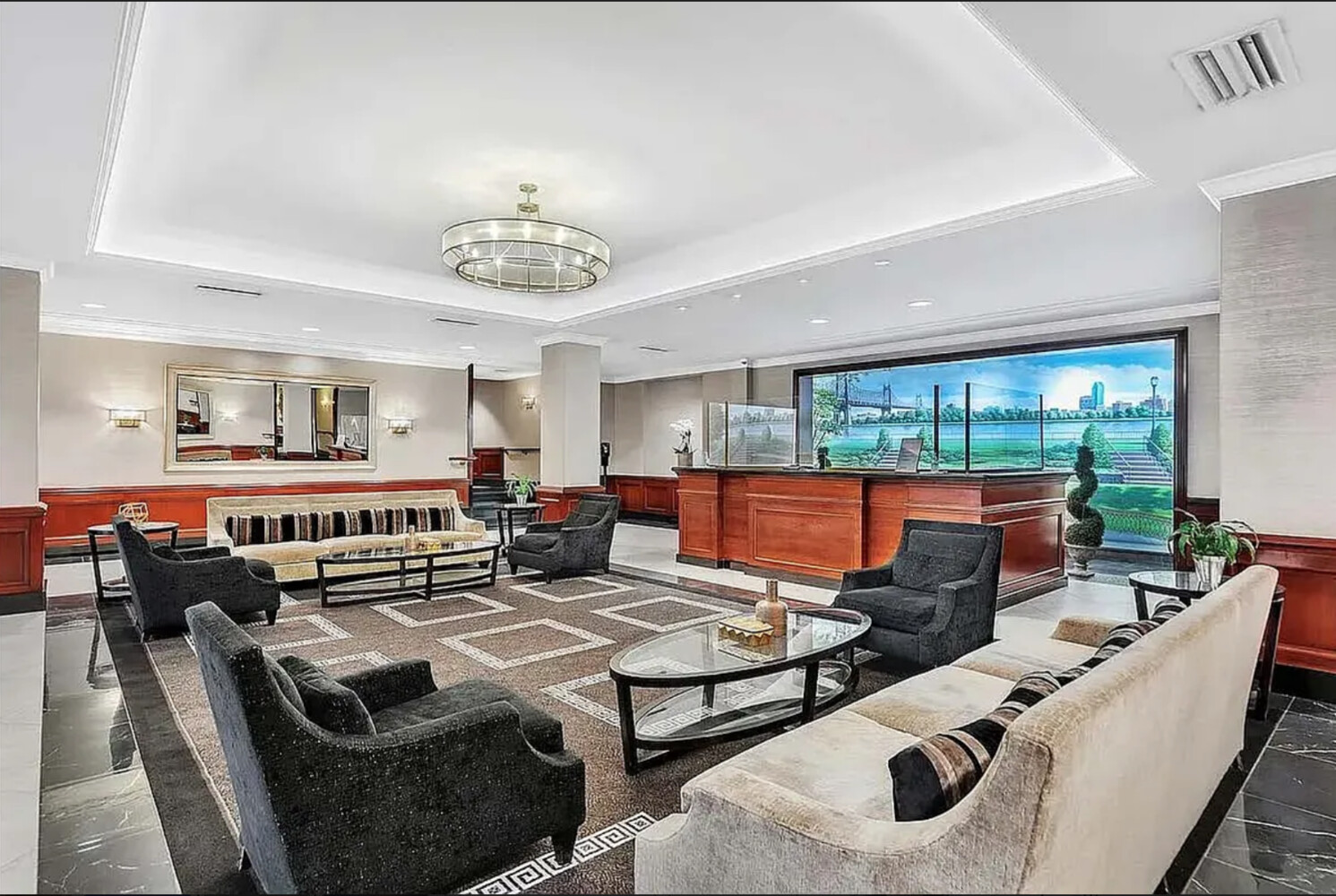 45 Sutton Place South, Unit 14F Manhattan, NY 10022 - Photo 12 of 20 a living room with furniture and a table