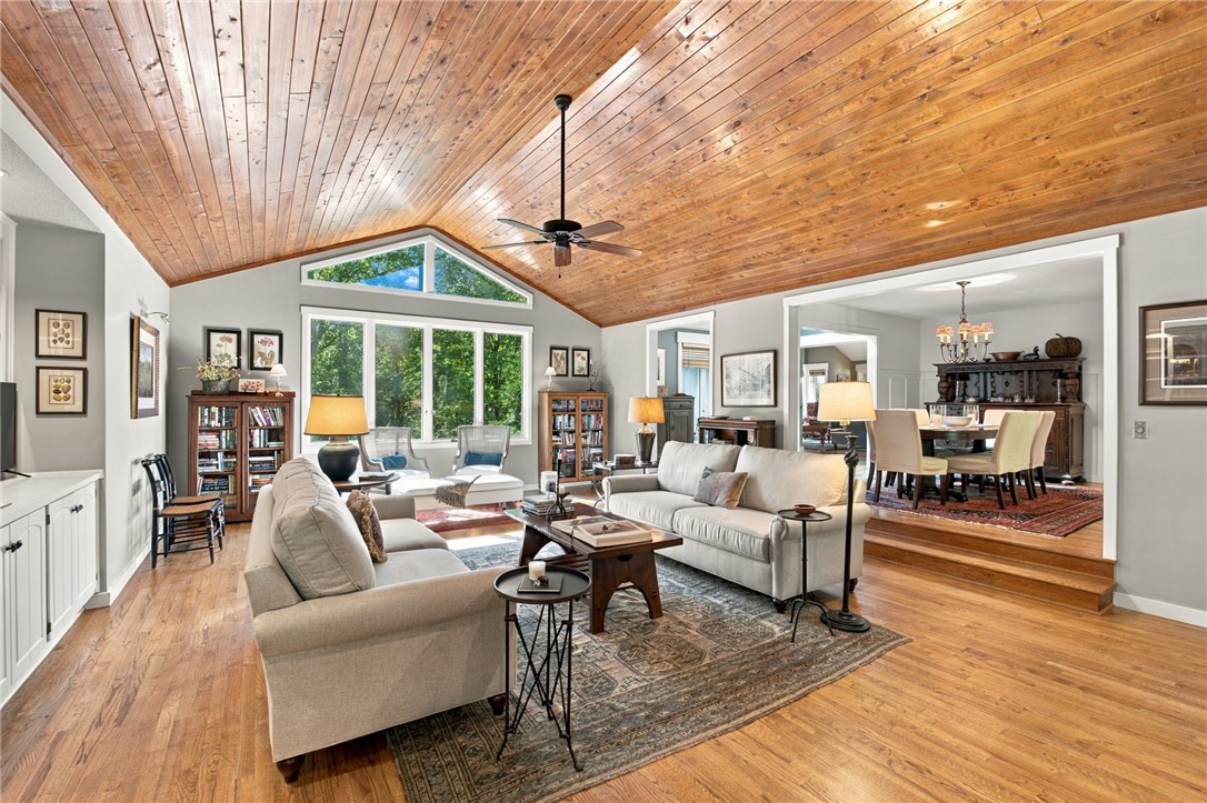 604 Ridgecrest Drive Clemson, SC 29631 - Photo 12 of 50 Rich wood plank ceilings and polished hardwood flooring define this spacious, light-filled living area.
