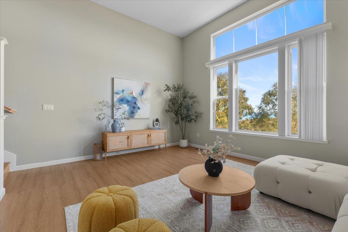 133 Cliff Swallow Court Brisbane, CA 94005 - Photo 11 of 39 a living room with furniture and a large window