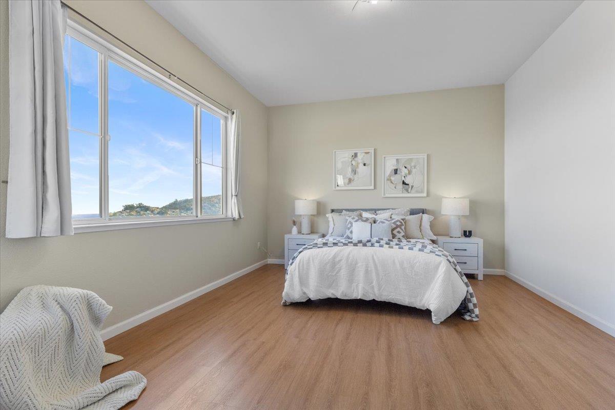 133 Cliff Swallow Court Brisbane, CA 94005 - Photo 20 of 39 a bedroom with a bed and window